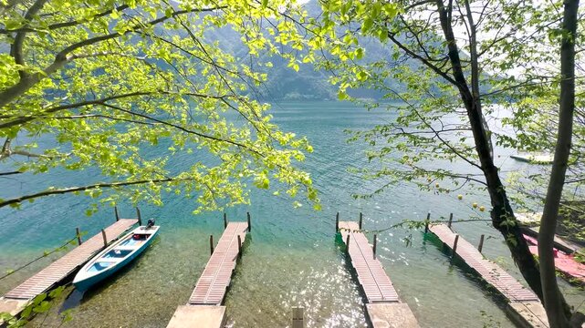 Calm Lake with Small Pier and Boats, Peaceful Forest Nature Landscape, Relaxing Background for Travel, Wellness, Meditation