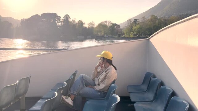 Woman Relaxing on Lake Como Boat Cruise Enjoying Scenic Village Views, Travel Lifestyle Experience in Italy Tourism Destination
