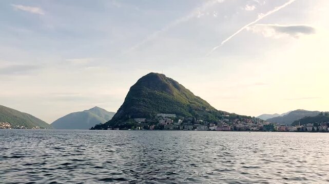 Lake Lugano View Through Lush Park Vegetation with Monte San Salvatore Mountain, Scenic Nature Landscape for Travel and Relaxing Background