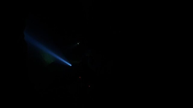 cave diving underwater scuba divers exploring cave dive with torch light in cavern ocean scenery