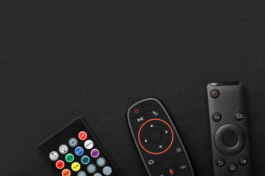 Different remote controllers on black background