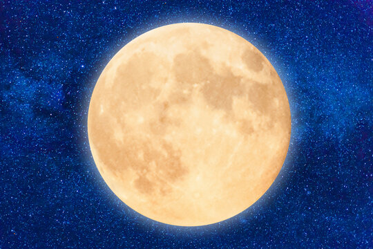 Full orange moon on dark blue night sky with many stars, Moon Artemis program concept