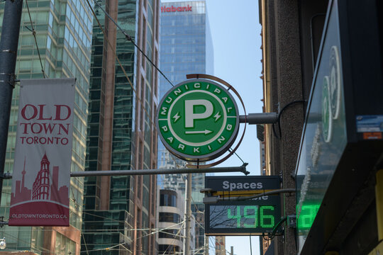 wall mounted projecting sign at Municipal Parking lot, 40 Richmond St E, Toronto