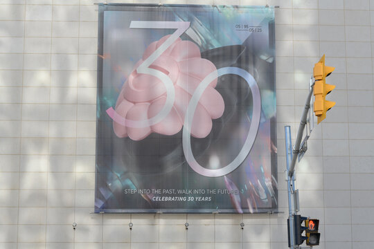 banner outside the Bata Shoe Museum (1995), 327 Bloor Street West. Designed by Raymond Moriyama, the deconstructivist limestone structure mimics a tilted shoebox lid.