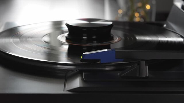 Stylus needle playing spinning vinyl record on turntable, analog music concept   