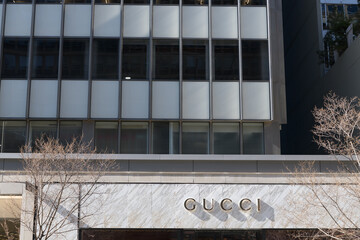Naklejka premium exterior building facade and sign outside Gucci, a luxury goods boutique, located at 130 Bloor St W, Toronto