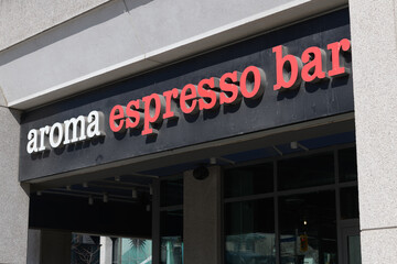 Naklejka premium exterior building and sign of Aroma Espresso Bar, a cafe, located at 137 Bremner Blvd inside Infinity Condos, Toronto