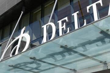 Naklejka premium close-up of sign over entrance canopy at Delta, a four-star hotel, located at 75 Lower Simcoe St, Toronto
