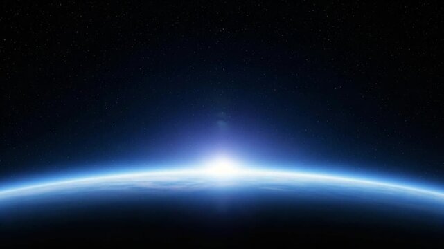 The curvature of the earth with a bright sun shining over the horizon in space with stars