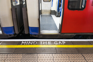 Mind the gap warning sign at London underground station © SellStock