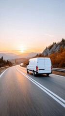 Obraz premium White cargo van driving on winding mountain highway at sunrise