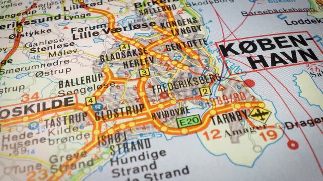 Cinematic glide over road map showing route to Copenhagen, Denmark travel destination concept