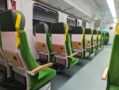 Warsaw, Poland, October 13, 2025: Empty seats inside the modern FLIRT electric passenger train, operated by Polish Railways, travel through Warsaw.