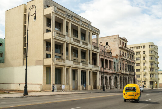 Cuba, Havana.  a Cocotaxi, navigating the seafront road in Old Havana.