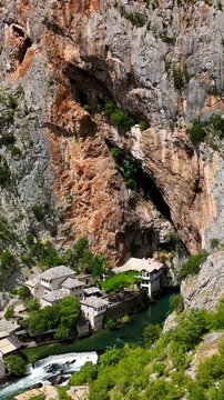 Vertical aerial drone view of the Tekija in Blagaj, Bosnia and Herzegovina. It rises atop a karst hill near Mostar. The Tekija, a dervish house, is located at the source of the Buna River.