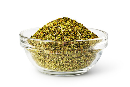 Dried oregano spices filling a glass bowl for cooking