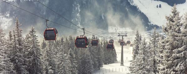 Cold winter day alpine slope ski snowboard Kohlmaisbahn gondola station lift. Saalbach-Hinterglemm ski circus panorama resort. Winter frosted mountain slopes cold air travel mood scenic silence © Kyryl Gorlov