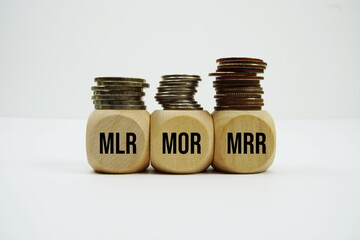 Stacks of coins with letters MLR, MOR, MRR Financial concept © may1985