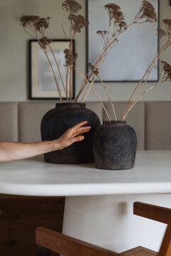 Modern minimalist living room with cozy decor and stylish vases