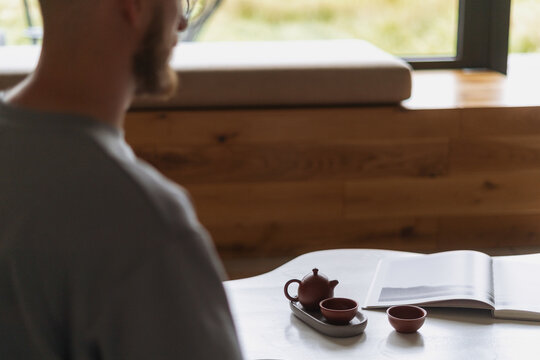 Relaxing at a white coffee table enjoying tea in a cozy living room