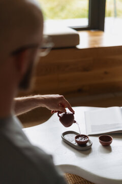 Cozy living room setup with a white coffee table and a tea ritual