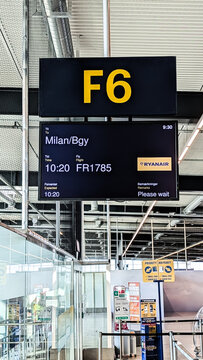 Copenhagen, Denmark - April 7 2026: Airport departure board showing flight info to Milan at gate F6 with Ryanair at Copenhagen Airport