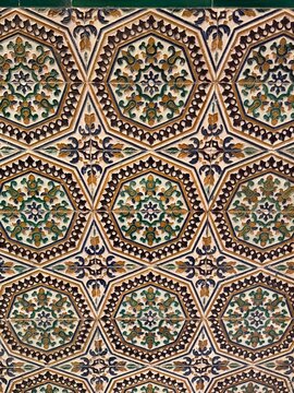  Traditional Andalusian ceramic tile pattern from Seville, Spain. Repeating geometric hexagonal shapes with floral motifs inspired by Moorish and Islamic decorative architecture.