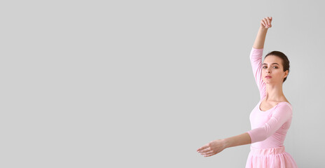 Beautiful young ballerina on light background © Pixel-Shot