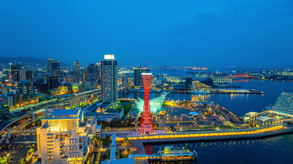 Naklejka premium Cityscape and traffic at night in Kobe, Japan.