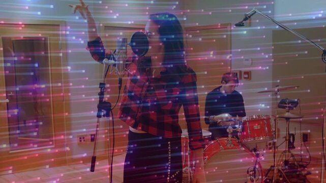 Drummer starting beat, vocalist leaning into pop-filter mic, tracking song while streaks overlaying