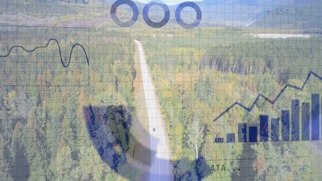 Tracking drone shot following paved road through forest, showing two vehicles and analytics overlay
