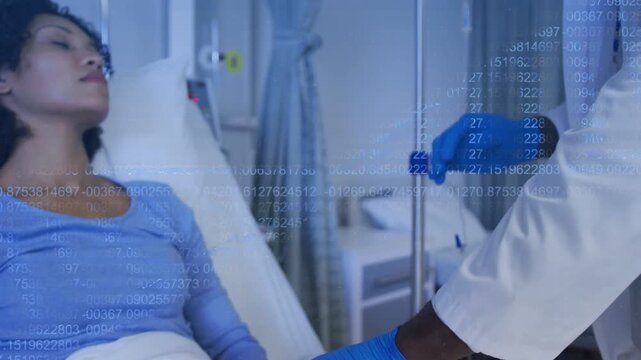 Vertical video: Clinician checking wrist pulse, camera zooming out then hanging IV bag for infusion