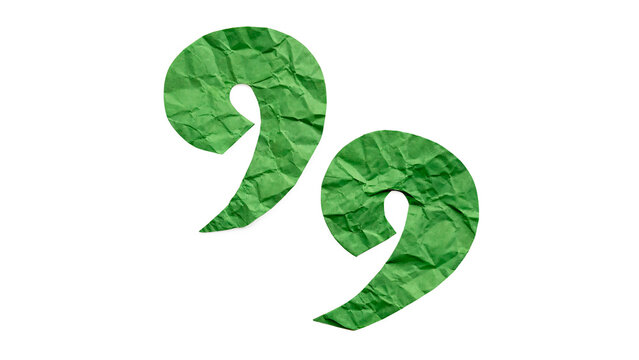 Crumpled green quotation marks made of paper isolated on transparent background