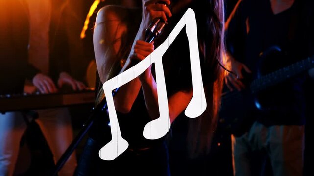 Vertical video: Singer gripping mic singing, camera zooming, note over singer, band playing music