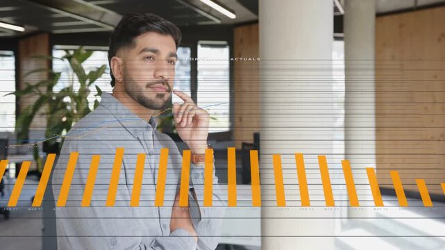 Vertical video: On update man near column watching orange overlay rising, checking business metrics