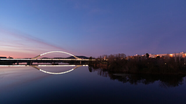 Sunset view of the Guadiana River as seen from the Puente Romano bridge in Merida Spain ESP