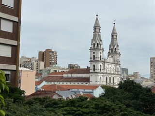 Obraz premium Nossa Senhora das Dores Church in Porto Alegre skyline under cloudy sky, southern Brazil