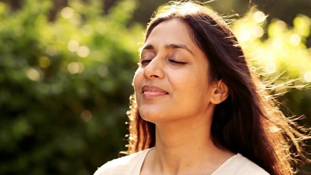serene woman smiling outdoors in nature