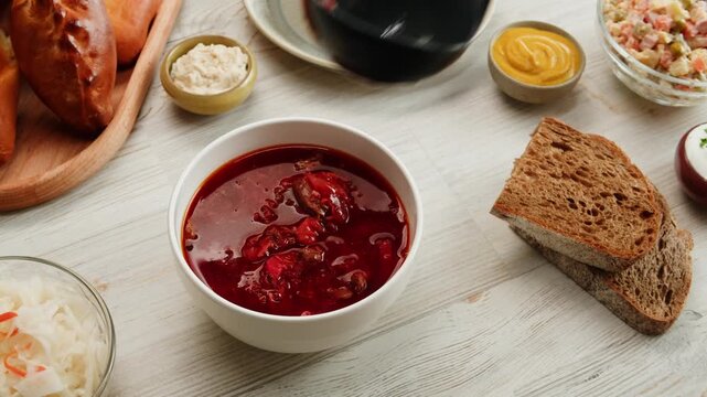 Beetroot soup, Cooking traditional national Slavic Russian, Ukranian soup Borsch close-up. Boiling red soup with vegetables and turkey meat and spices. Special red for Borsh from beet, tomatoes pasta