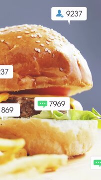 Vertical video: Burger being revealed by pan down, badges popping, counting then fading for ads