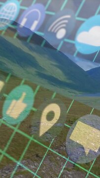 Vertical video: Translucent app grid sliding over valley while device tilting revealing tech icons