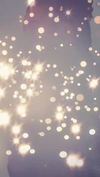 Vertical video: Singer leaning into vintage mic, starting vocal for music, rim bokeh rising, fading