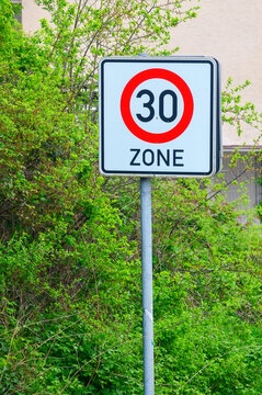 Speed limit 30 zone sign indicating a reduced speed area for safety