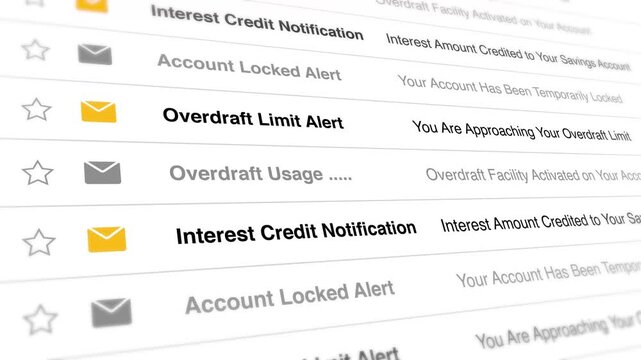 A close-up video of a computer screen displaying various email notifications about bank account alerts and credits.