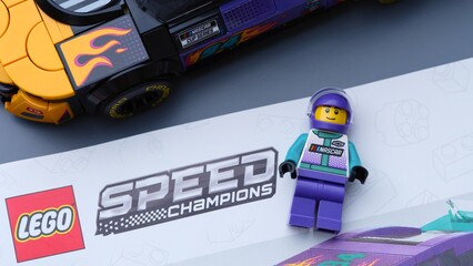Naklejka premium Tambov, Russian Federation - January 04, 2026 Lego Speed Champions kit with nstruction book, driver minifigure and Nascar Next Gen Chevrolet Camaro car. Close-up