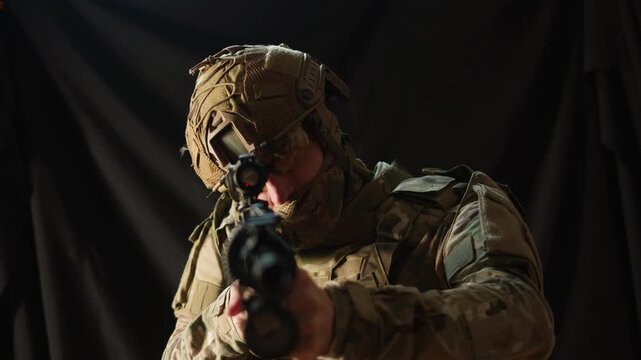 Portrait of modern soldier in military uniform and a helmet with headphones rifle, army warrior Warrior Military Gear Ready for Battle, airsoft Players in Tactical Gear and Riot Police Training