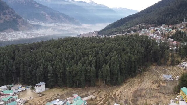 Drone Soaring Above Deodar Forests and Beas River in the Himalayan Valley of Manali