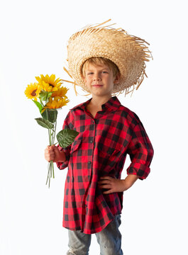 Boy dressed for the June festivals in Brazil with a straw hat and plaid shirt. Isolated.