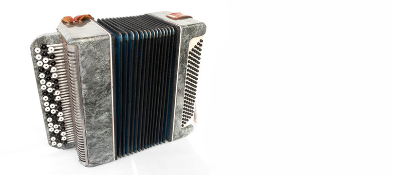 vintage musical accordion, on an isolated white background with copy spase