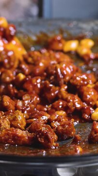 Korean Street Food - Dakgangjeong, Sweet Crispy Korean Fried Chicken, variety of different traditional food selection in Seoul, South Korea, night street market with local vendor stalls cooking 